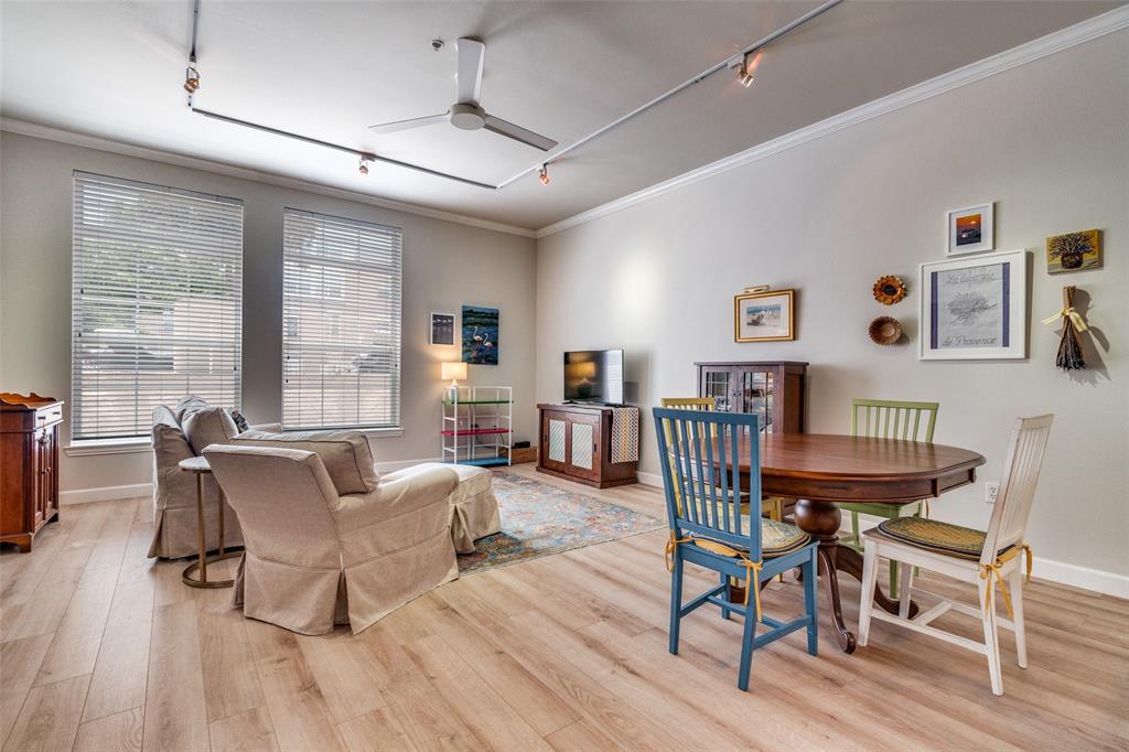 2305 Worthington Street, Unit 104 Dallas, TX 75204 - Photo 9 of 25 a dining room with furniture window and wooden floor