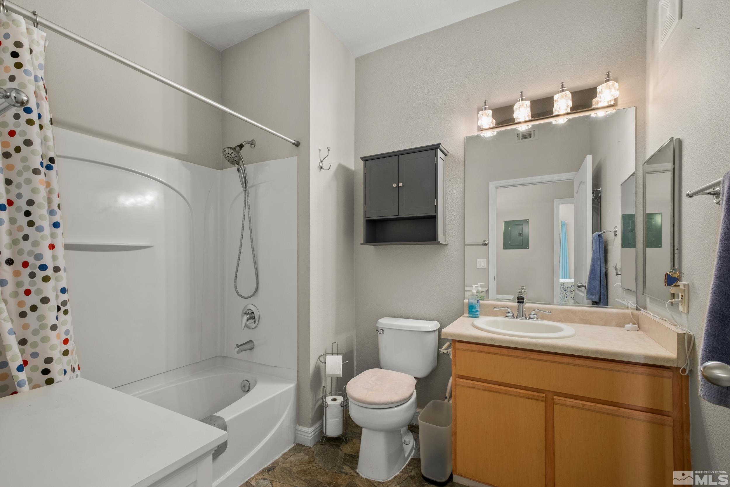 6850 Sharlands Avenue, Unit 1100 Reno, NV 89523 - Photo 11 of 26 a bathroom with a sink toilet and shower