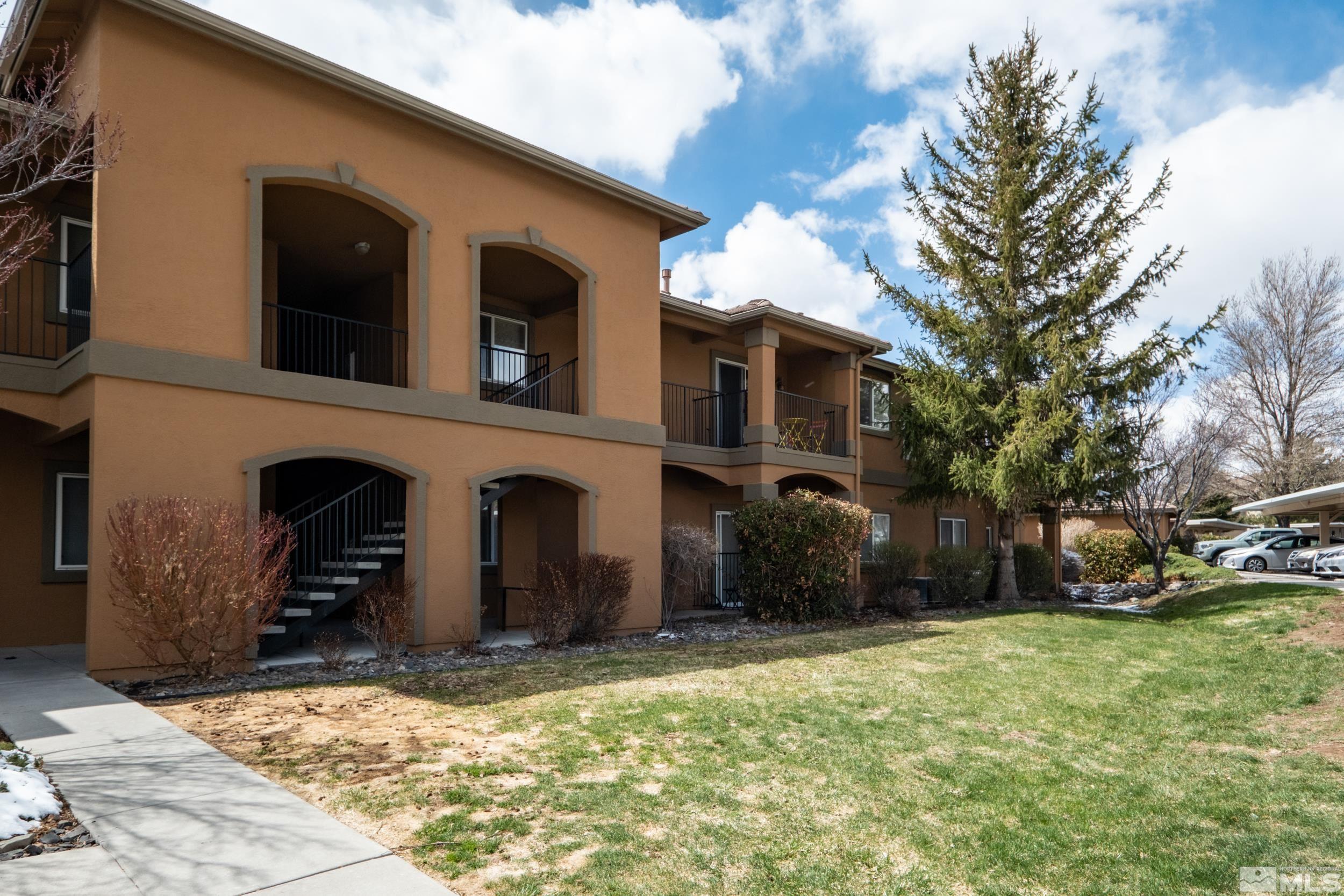 6850 Sharlands Avenue, Unit 1100 Reno, NV 89523 - Photo 15 of 26 a view of a house with a yard