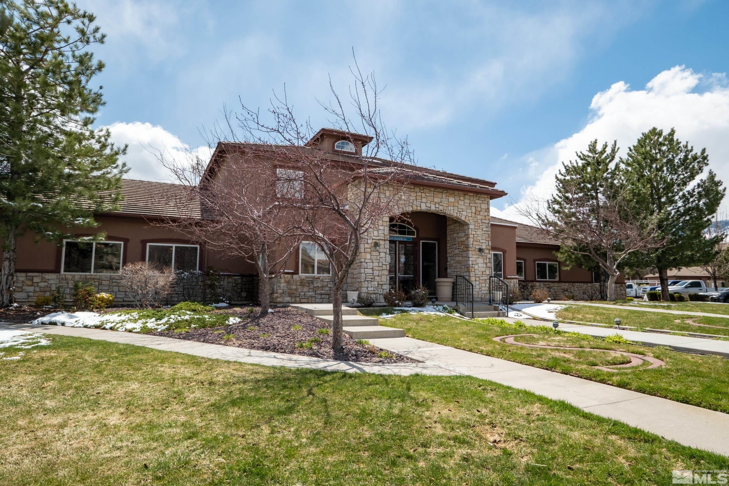 6850 Sharlands Avenue, Unit 1100 Reno, NV 89523 - Photo 17 of 26 a view of a house with a yard