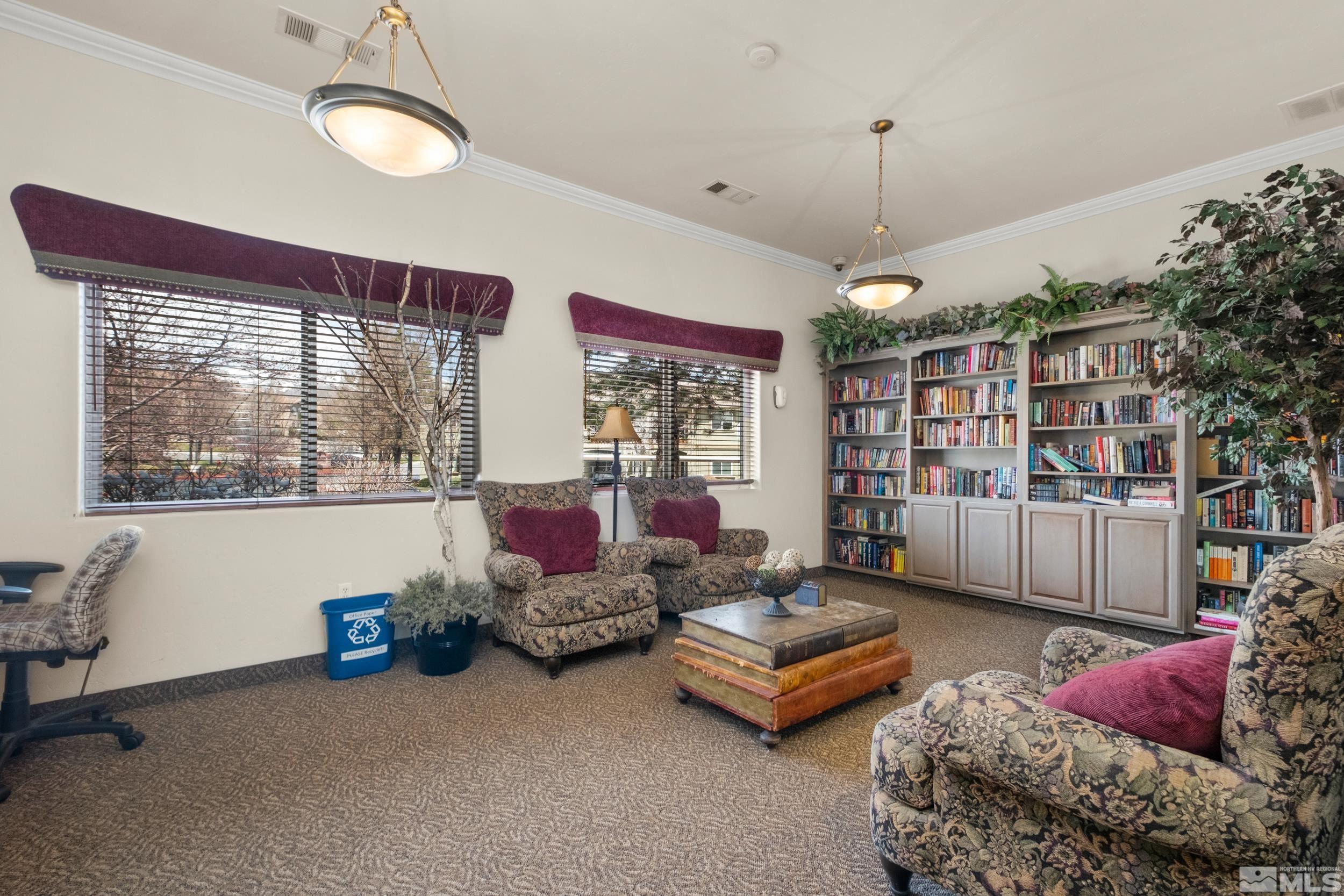 6850 Sharlands Avenue, Unit 1100 Reno, NV 89523 - Photo 19 of 26 a living room with furniture toys and a chandelier