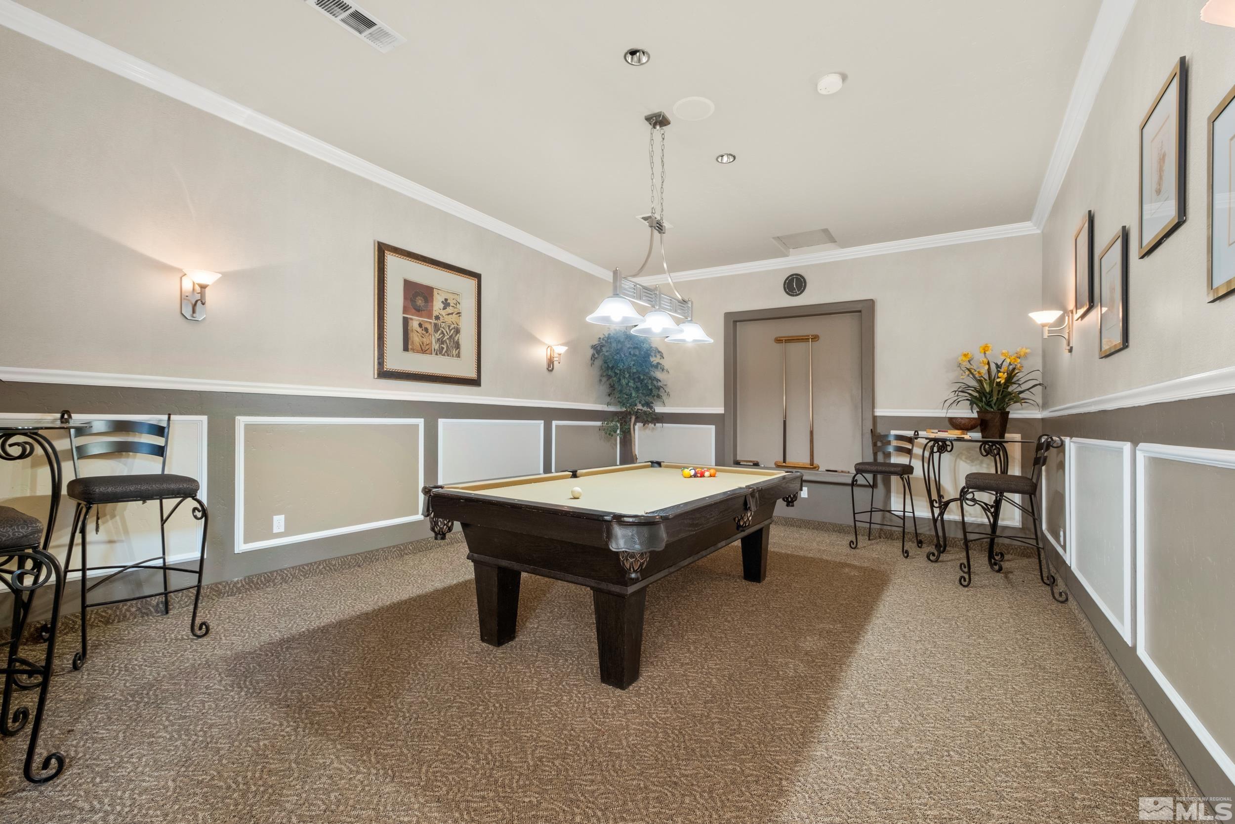 6850 Sharlands Avenue, Unit 1100 Reno, NV 89523 - Photo 21 of 26 a living room with furniture a table and chairs