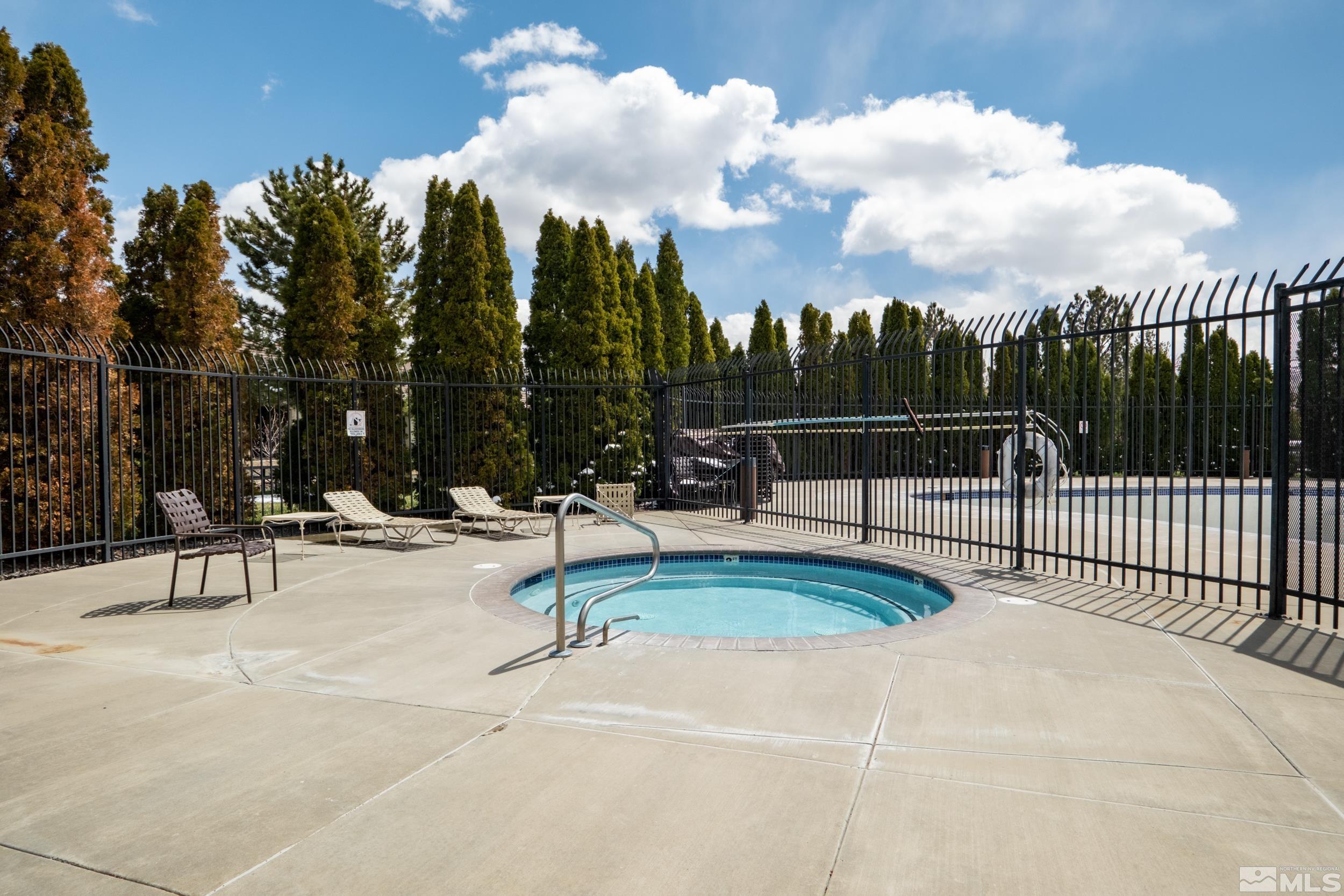 6850 Sharlands Avenue, Unit 1100 Reno, NV 89523 - Photo 24 of 26 a view of a park with swings and slides