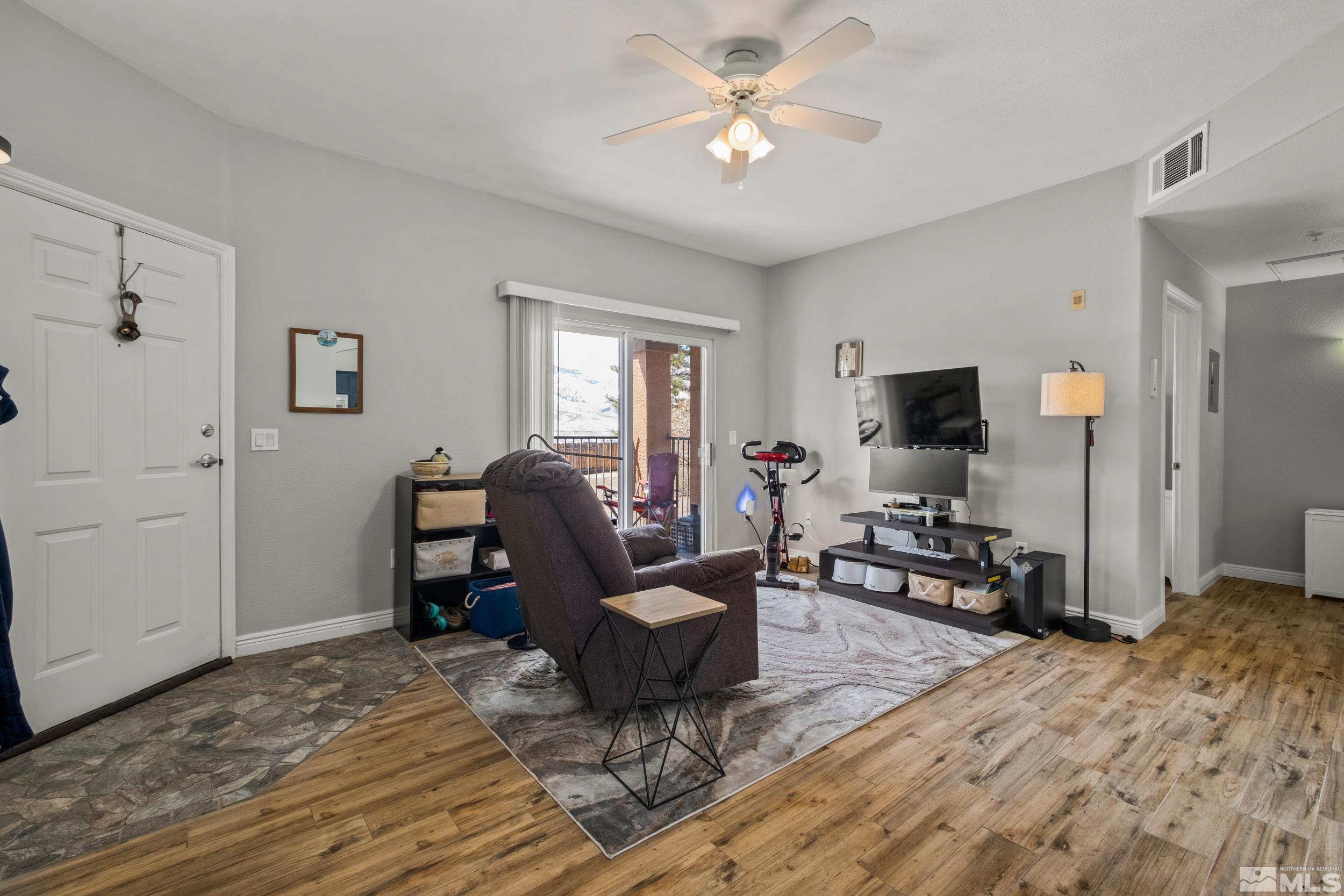 6850 Sharlands Avenue, Unit 1100 Reno, NV 89523 - Photo 4 of 26 a view of a livingroom with workspace and a window