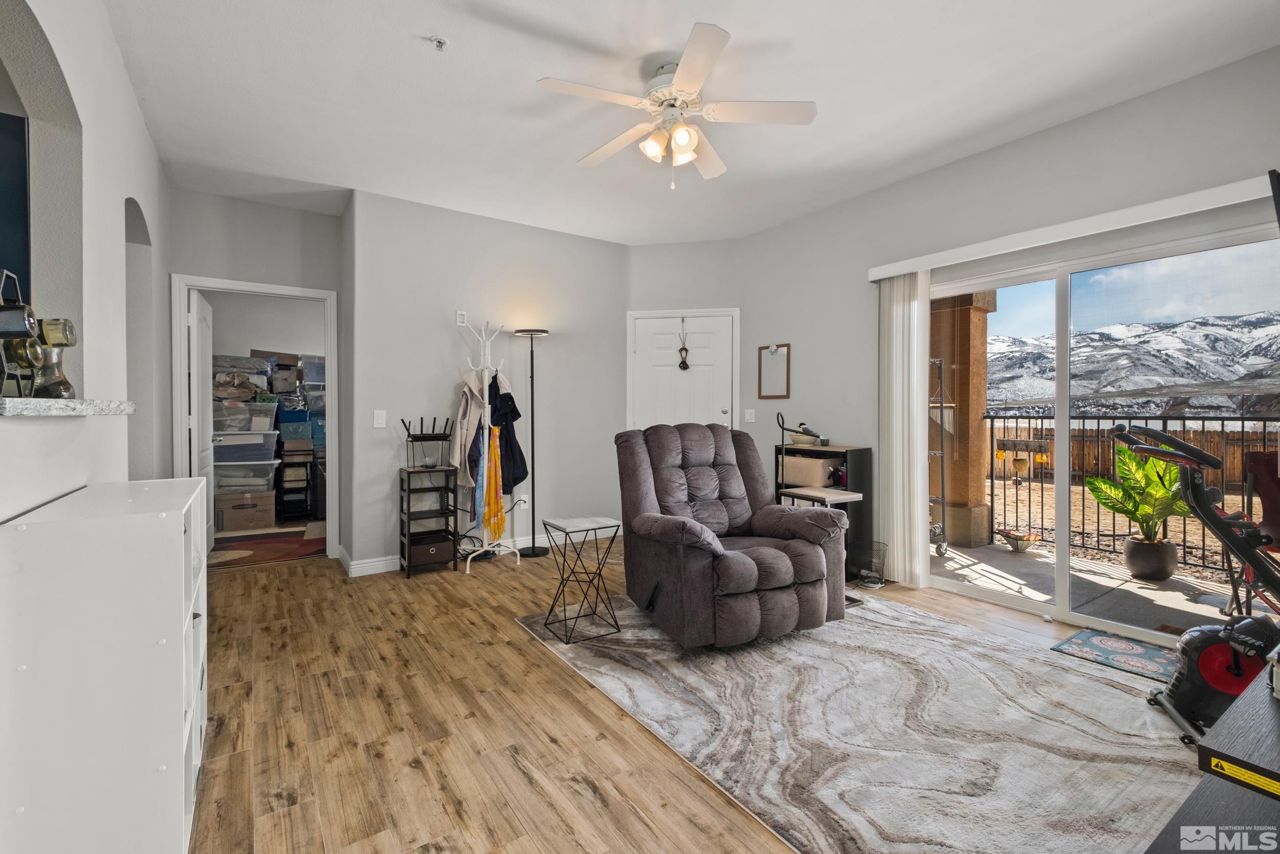 6850 Sharlands Avenue, Unit 1100 Reno, NV 89523 - Photo 5 of 26 a living room with furniture and a chandelier