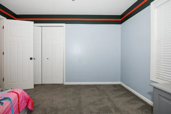a view of a livingroom with a hardwood floor and a ceiling fan
