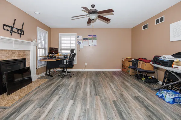 a living room with furniture and a fireplace