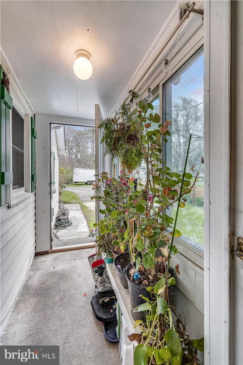 128 Collier Road Grasonville, MD 21638 - Photo 3 of 37 Breezeway Entrance