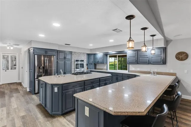 a room with pool table and windows