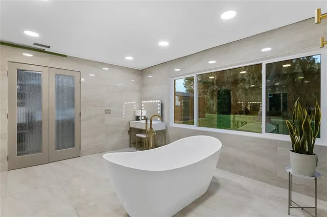 a view of a lobby with a floor to ceiling window and dining room