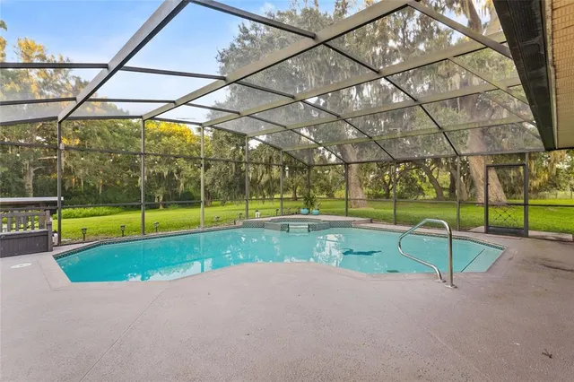 a view of yard with swimming pool