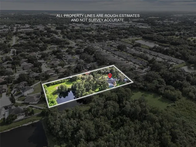 a view of roof with sitting area and wooden fence