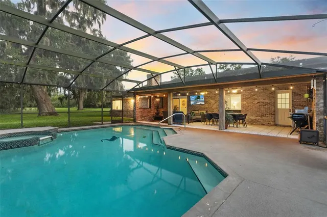 a view of a swimming pool with a yard