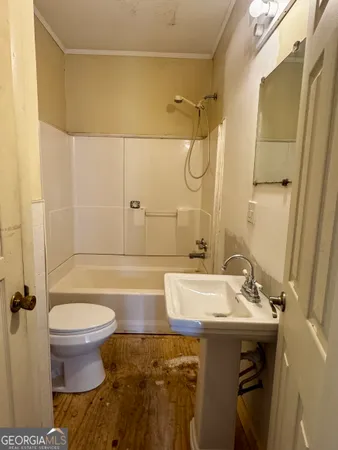 a bathroom with a sink and toilet