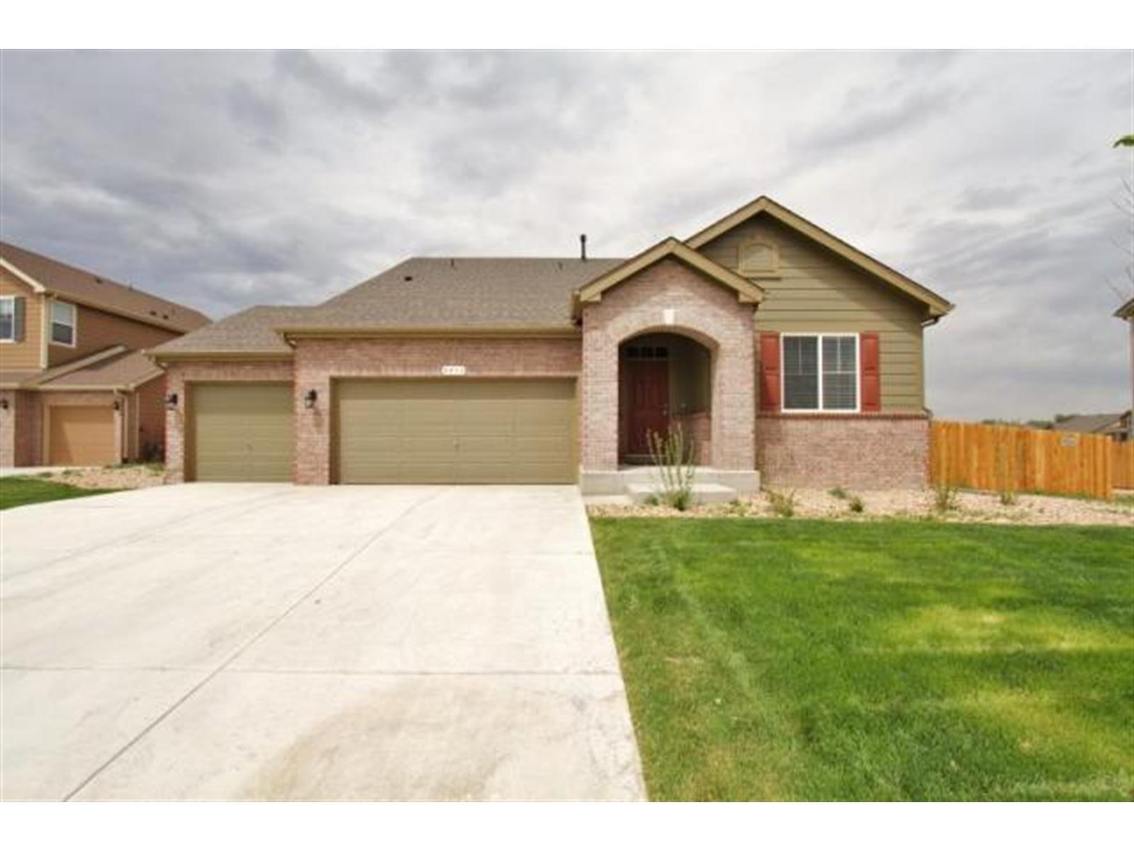 4433 Bramble Road Frederick, CO 80504 - Photo 1 of 1 a front view of a house with a garden
