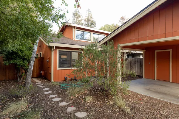 a front view of a house with garden