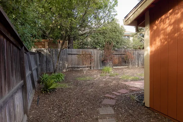 a backyard of a house with lots of green space