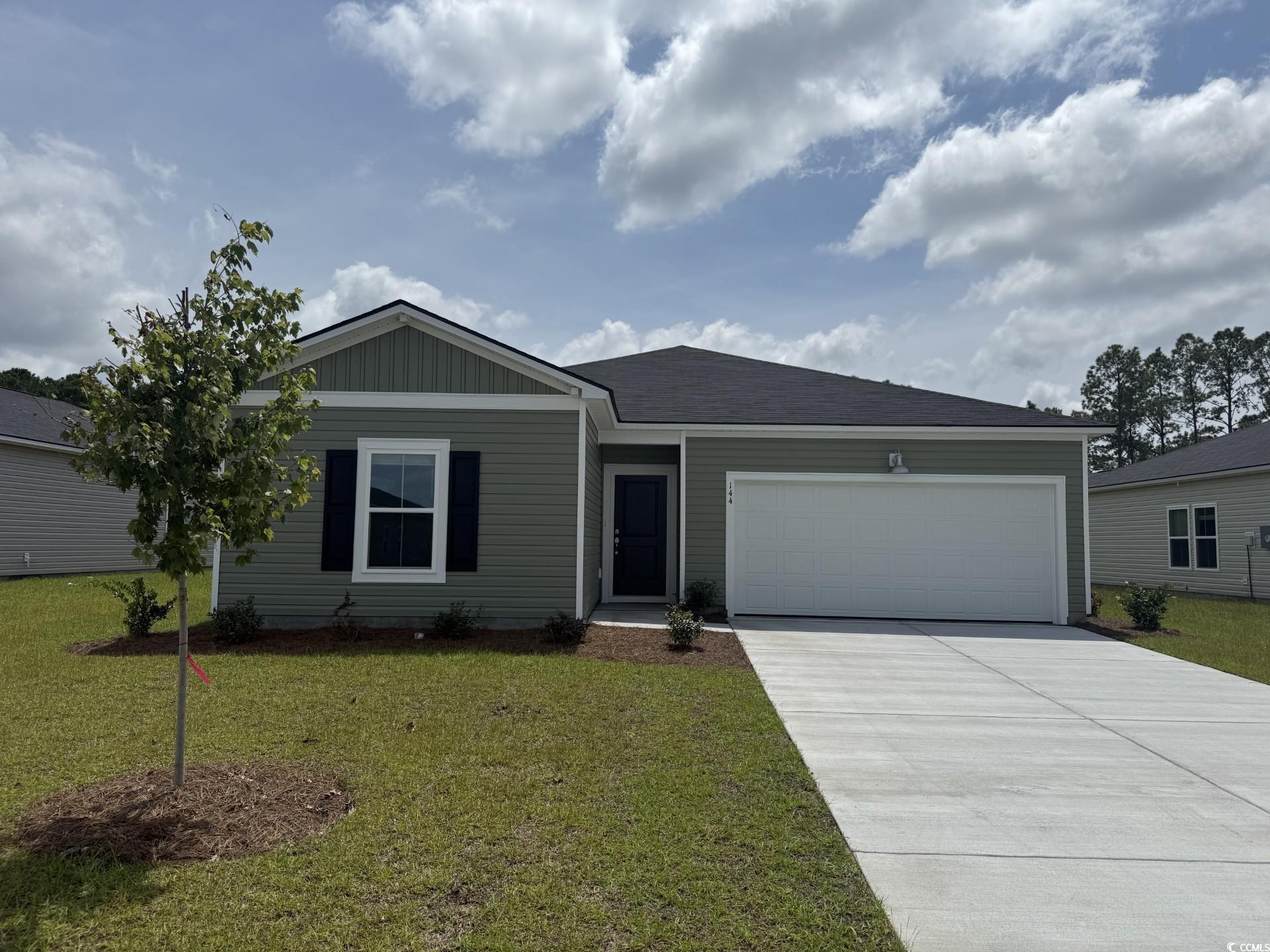 144 Warner Xing Way Loris, SC 29569 - Photo 1 of 22 Ranch-style house with an attached garage, a front