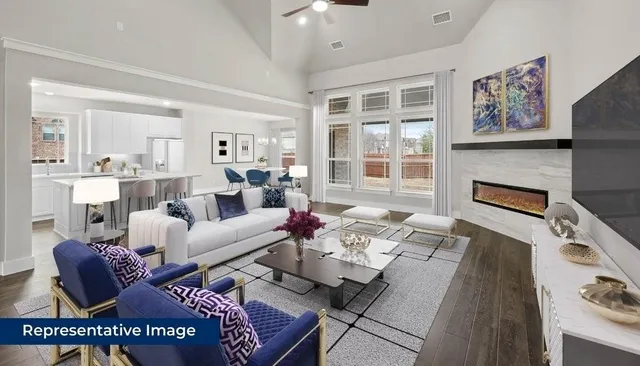 a living room with furniture fireplace and a table