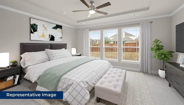 a spacious bedroom with a large bed and a couch