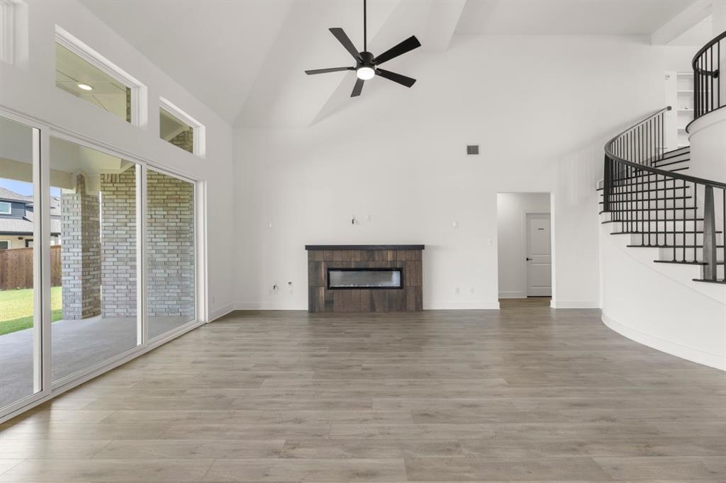 9621 Chesney Drive Forney, TX 75126 - Photo 20 of 36 a view of an empty room with a ceiling fan and window