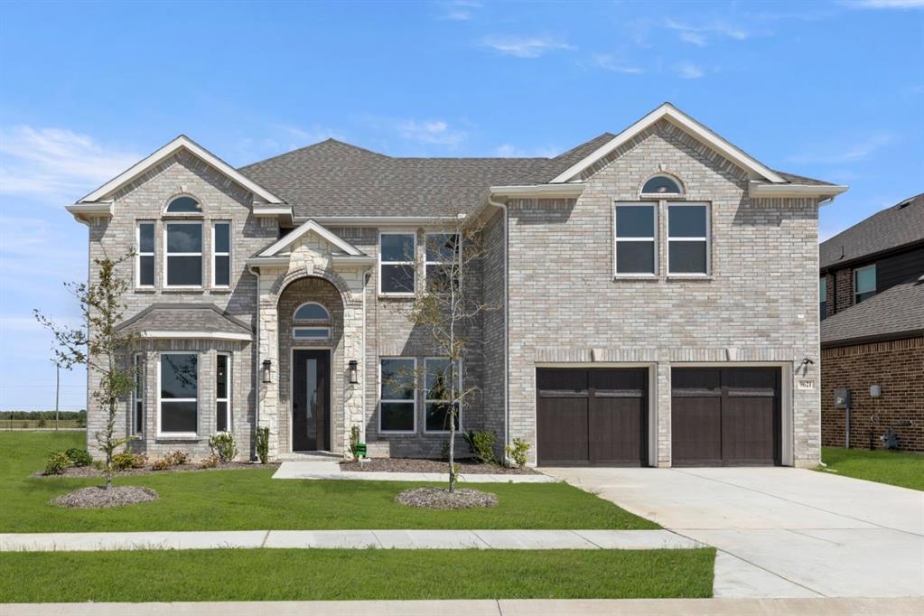 9621 Chesney Drive Forney, TX 75126 - Photo 2 of 36 a front view of a house with a yard