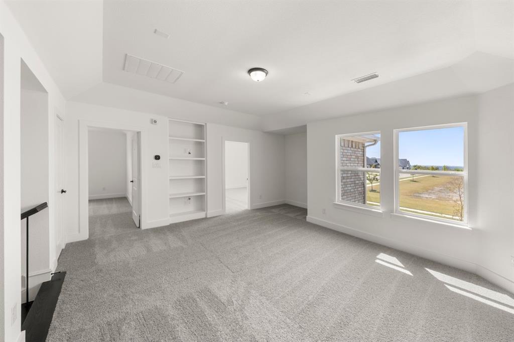 9621 Chesney Drive Forney, TX 75126 - Photo 35 of 36 a view of an empty room with a window