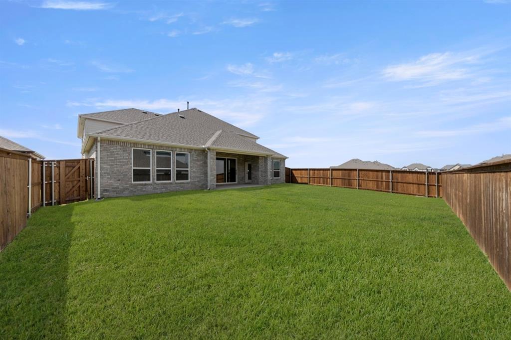 9621 Chesney Drive Forney, TX 75126 - Photo 7 of 36 a front view of a house with garden