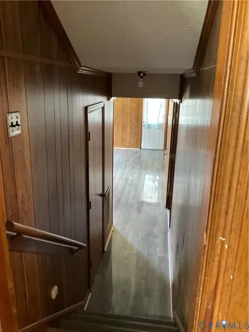 an empty room with a fireplace and windows