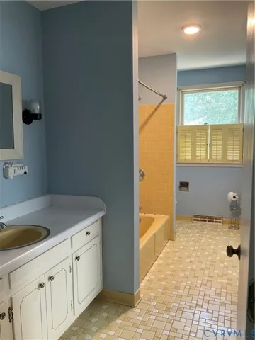 a kitchen with a sink stove top oven and cabinets