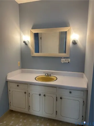 a view of storage and utility room with a window