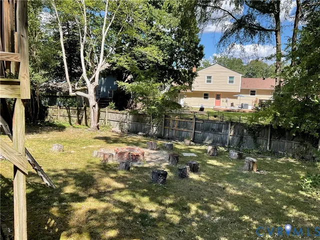 a backyard of a house with lots of green space
