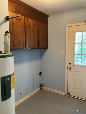 a view of room with window and cabinet