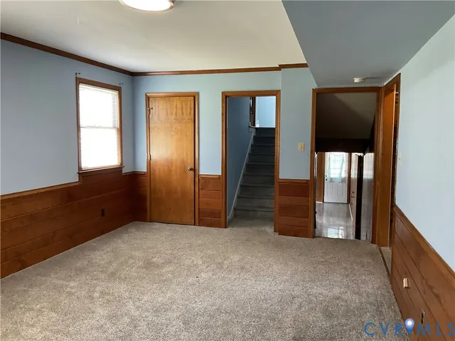 an empty room with wooden floor