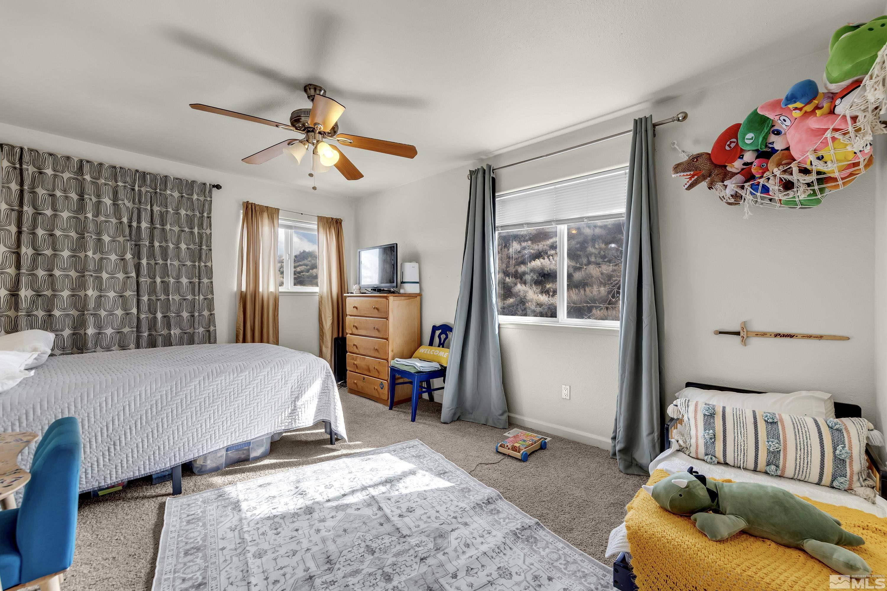 6750 Peppermint Court Reno, NV 89506 - Photo 17 of 33 a bed room with furniture and a window