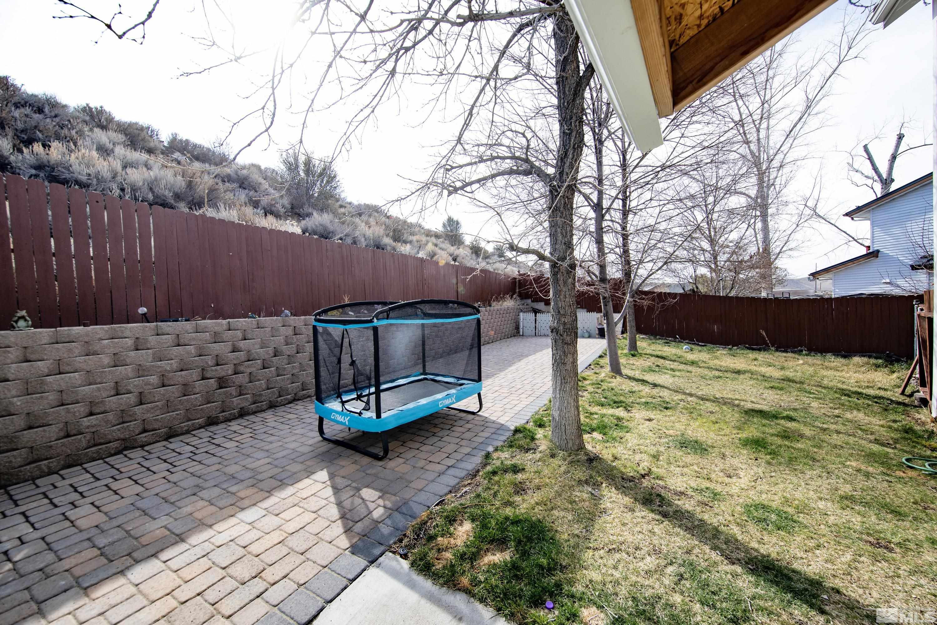 6750 Peppermint Court Reno, NV 89506 - Photo 28 of 33 a backyard of a house with lots of green space