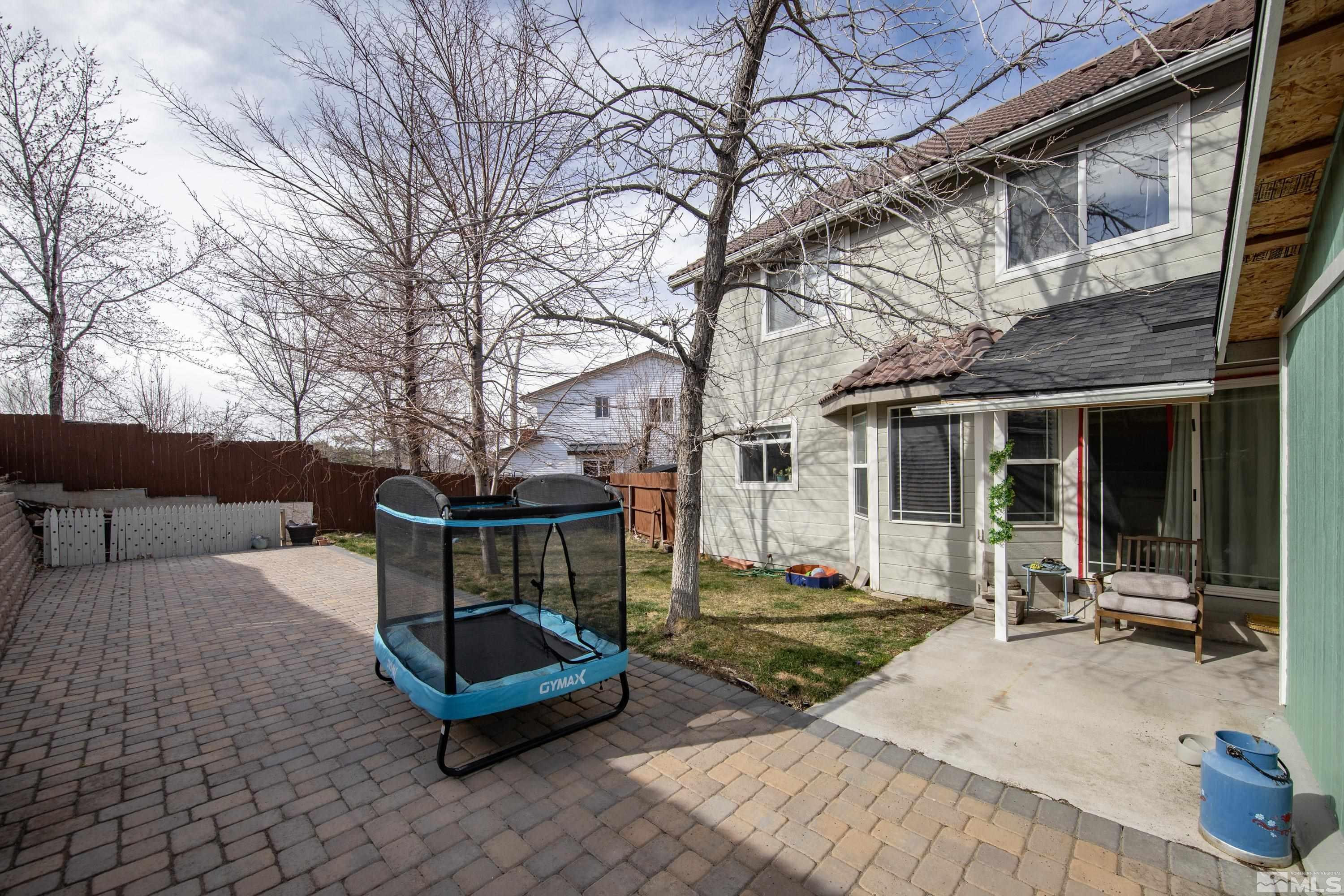 6750 Peppermint Court Reno, NV 89506 - Photo 29 of 33 a backyard of a house with outdoor seating