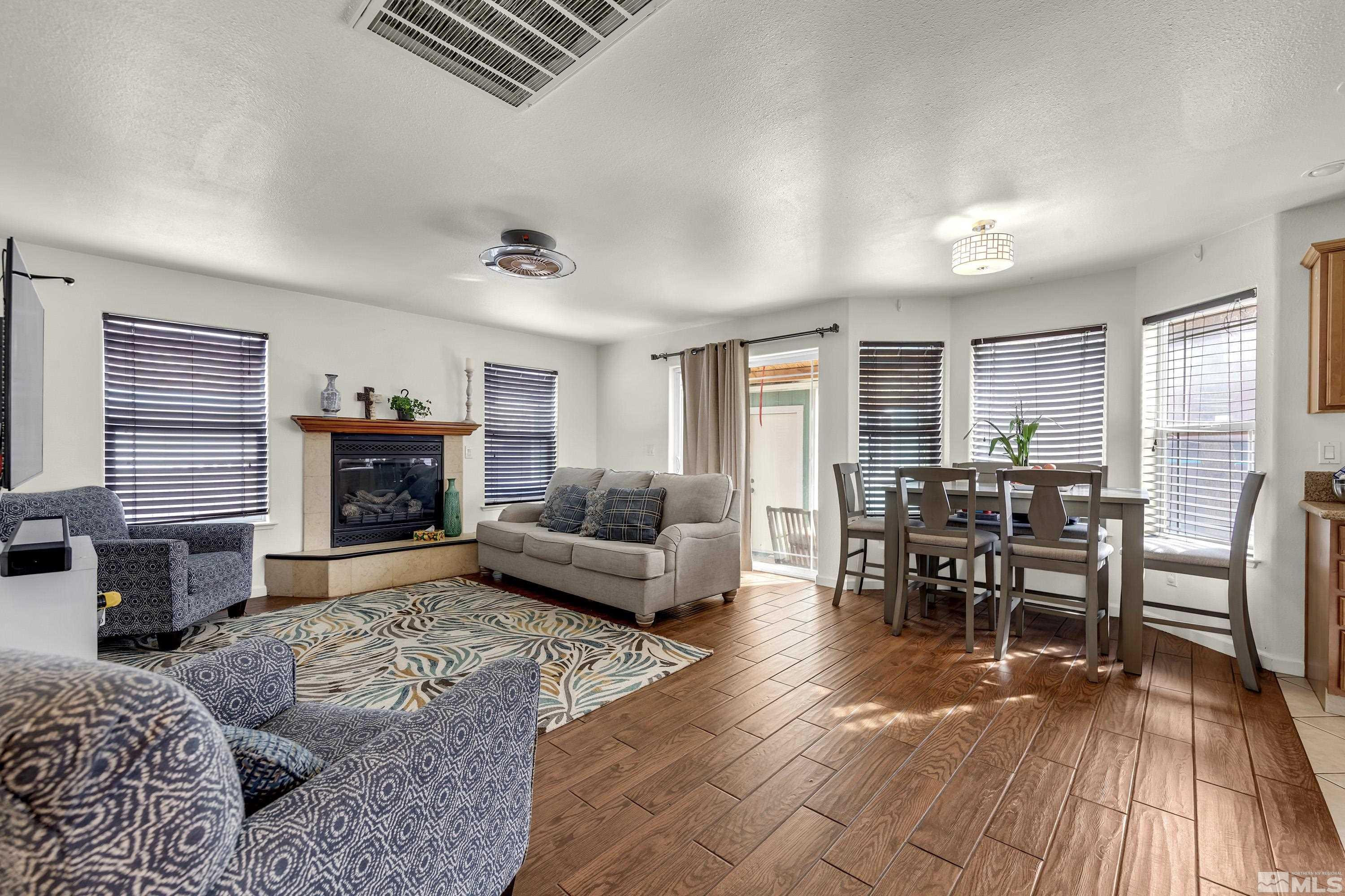 6750 Peppermint Court Reno, NV 89506 - Photo 5 of 33 a living room with furniture and a fireplace