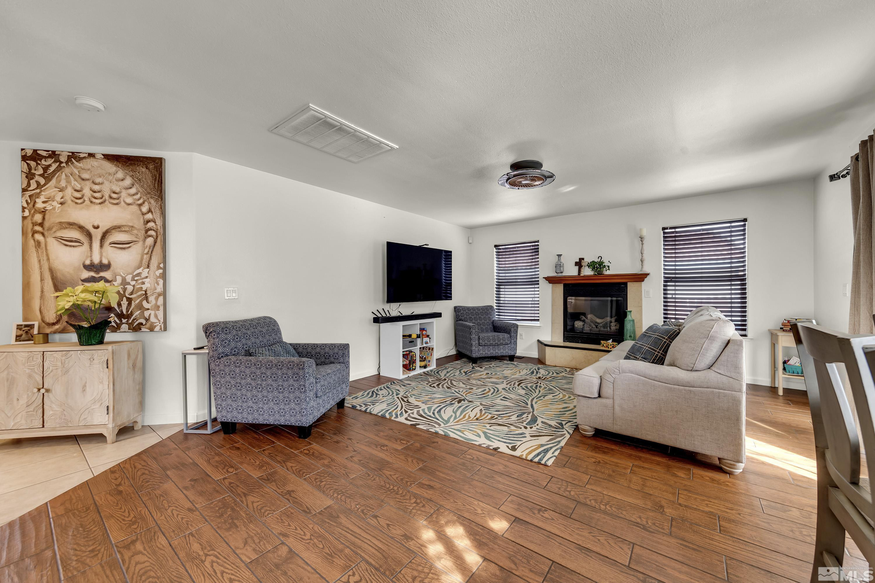 6750 Peppermint Court Reno, NV 89506 - Photo 6 of 33 a living room with furniture and a flat screen tv