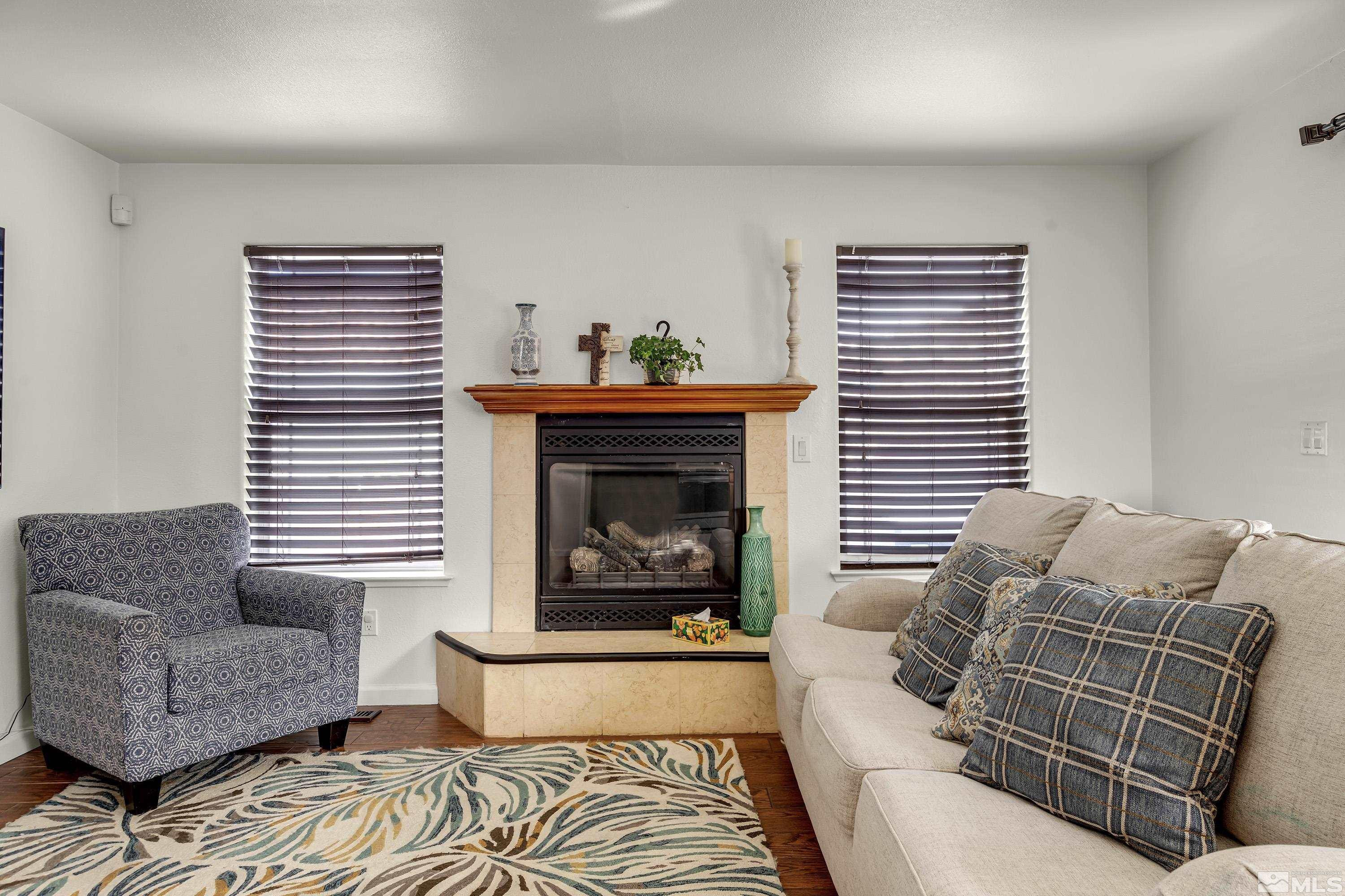 6750 Peppermint Court Reno, NV 89506 - Photo 7 of 33 a living room with furniture and a fireplace