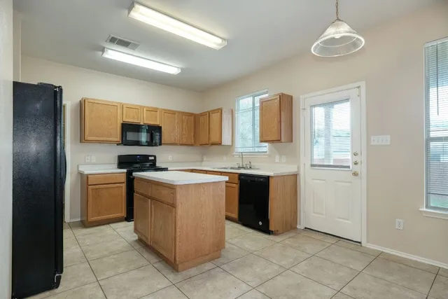 a kitchen with a stove microwave and refrigerator