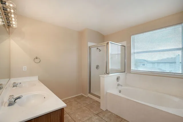 a bathroom with a bathtub and a sink
