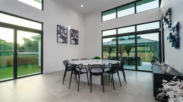 a living room with furniture and a lamp