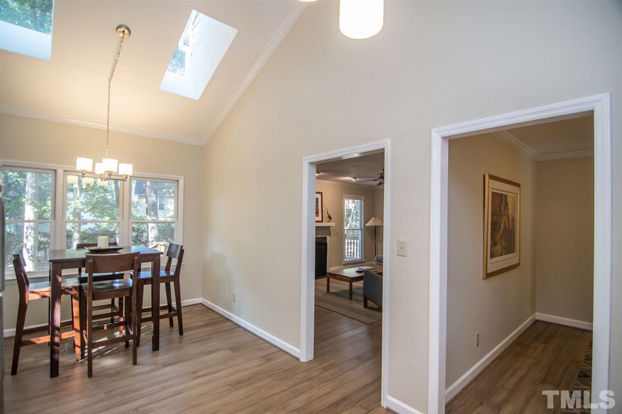 109 Boxford Road Morrisville, NC 27560 - Photo 11 of 27 a view of a dining room with furniture window and wooden floor