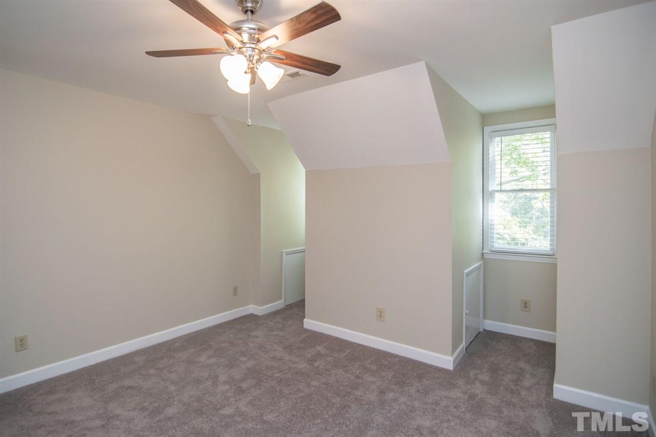 109 Boxford Road Morrisville, NC 27560 - Photo 17 of 27 an empty room with a window and a fan