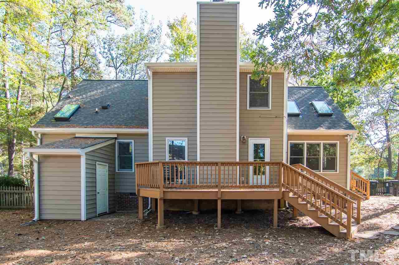 109 Boxford Road Morrisville, NC 27560 - Photo 23 of 27 a view of a house with a yard and wooden deck
