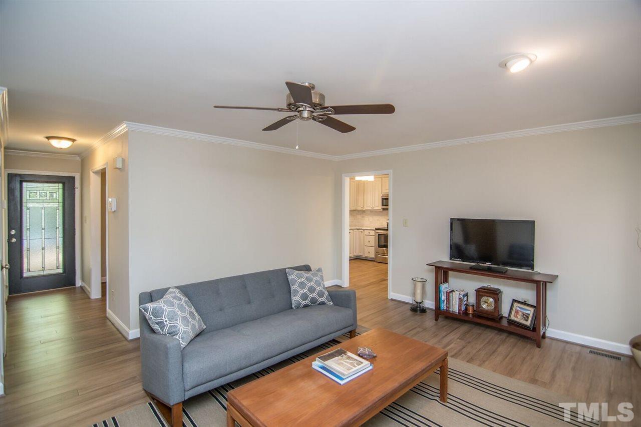 109 Boxford Road Morrisville, NC 27560 - Photo 4 of 27 a living room with furniture and a flat screen tv