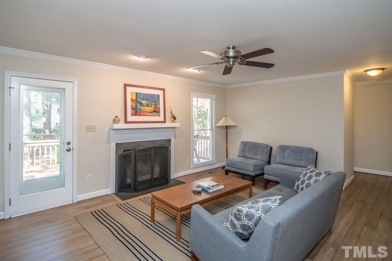 109 Boxford Road Morrisville, NC 27560 - Photo 5 of 27 a living room with furniture and a fireplace