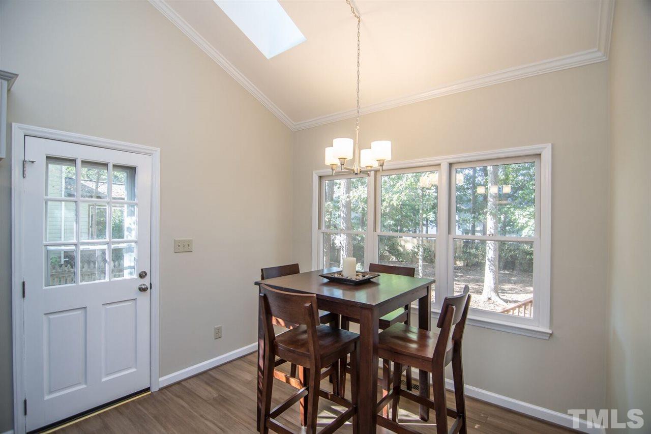 109 Boxford Road Morrisville, NC 27560 - Photo 9 of 27 a view of a dining room with furniture window and outside view