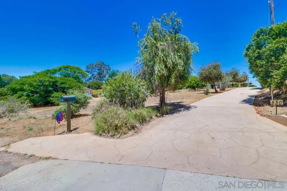 530 Mountain View Road El Cajon, CA 92021 - Photo 1 of 18 a view of a backyard of a house